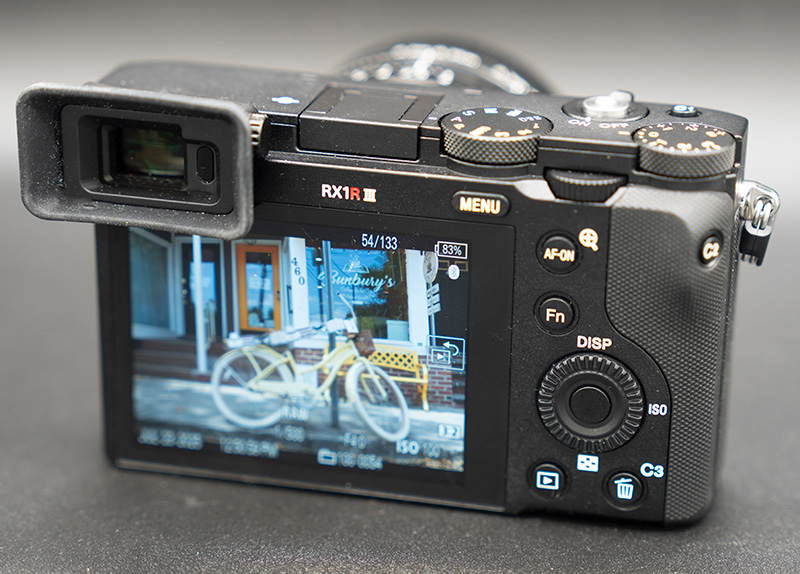 The back of the Sony RX1R III with a photo showing